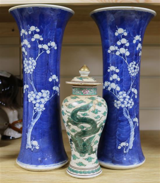 A pair of Chinese blue and white cherry blossom vases, 30cm, and a baluster vase and cover